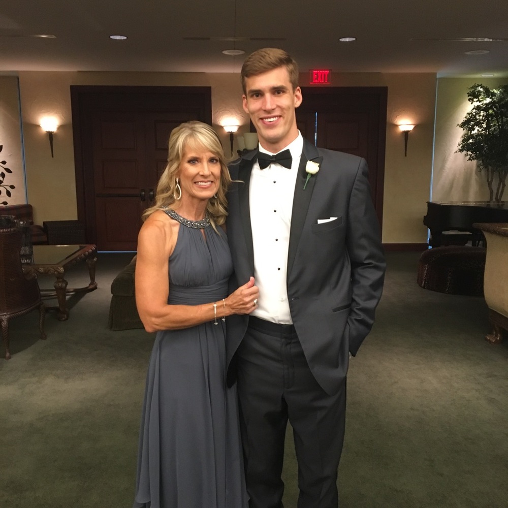 Steel gray long Mother of Groom dress. Rhinestones around collar. From:Nordstrom